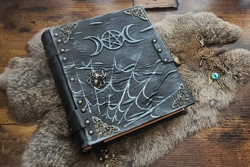 Handmade leather grimoire with triple moon and pentagram